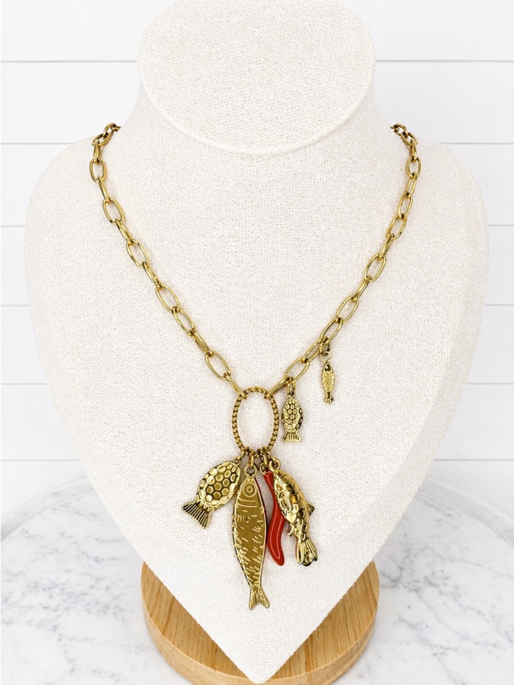Gold-Tone Fish Charm Necklace with Red Accent Stainless Steel